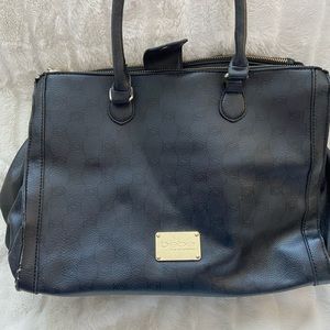 This purse has three sections with two zippers. It’s a bluish-grey color